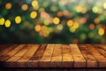 a wooden table with a blurry background of trees in the background with lights on it and a green boke of lights