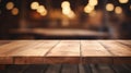 A wooden table with blurry lights in the background Royalty Free Stock Photo