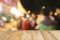 Wooden table board on front blurred night street background