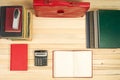 On a wooden table books, documents, calculator, red briefcase. Royalty Free Stock Photo