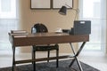 Wooden table and books in modern working room