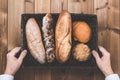 Wooden table and bread and hands