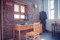 Wooden table, a chair and an old clothing in Xinan City Memory Park, Shijingshan, Beijing, China