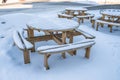 Wooden table and chair set with snow Royalty Free Stock Photo