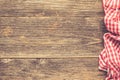 Wooden table with checkered textile Royalty Free Stock Photo