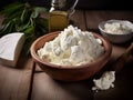 on wooden table cheese and plate with fresh ricotta