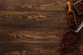 Wooden table with coffee beans in scoop composition Royalty Free Stock Photo
