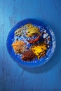 Wooden table of colorful spices. Top view Royalty Free Stock Photo