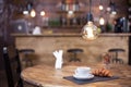 a wooden table with a cup of coffee, croissants and other treats Royalty Free Stock Photo