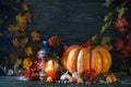 The wooden table decorated with vegetables, pumpkins and autumn leaves. Autumn background. Schastlivy von Thanksgiving