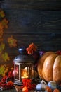 The wooden table decorated with vegetables, pumpkins and autumn leaves. Autumn background. Schastlivy von Thanksgiving