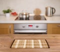 Wooden table on defocused kitchen bench background Royalty Free Stock Photo