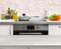 Wooden table on defocused rustic kitchen background Royalty Free Stock Photo