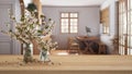 Wooden Table, Desk Or Shelf Close Up With Branches Of Cherry Blossoms In Glass Vase Over Blurred View Of Farmhouse Wooden Kitchen