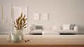Wooden table, desk or shelf close up with ceramic and glass vases with dry plants, straws over blurred view of white living room