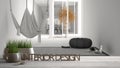 Wooden table, desk or shelf with potted grass plant, house keys and 3D letters making the words interior design, over blurred mini