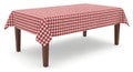 Red and white gingham patterned tablecloth on wooden table isolated on white background Royalty Free Stock Photo