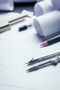 On a wooden table are drawings, compasses, pencil, ruler and sharpener Royalty Free Stock Photo