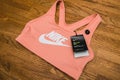 Wooden table with Female Nike Swoosh bra in classic style