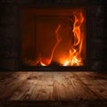 Wooden table with a fireplace Royalty Free Stock Photo