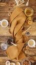 A folded kitchen towel around which fruit chips, dried fruits, nuts, honey and two cups of coffee Royalty Free Stock Photo