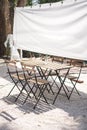 Wooden Table with Four Chairs prepare for dinner Royalty Free Stock Photo