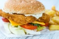 Wooden table with a fresh made Fish Burger Royalty Free Stock Photo