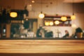 wooden table in front of abstract blurred restaurant lights background Royalty Free Stock Photo