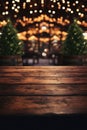 Wooden table in front of blurred background of Christmas market. Copy space . Royalty Free Stock Photo