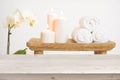 Wooden table in front of blurred background of spa products Royalty Free Stock Photo