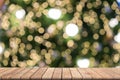Wooden table in front blurred christmas background, bokeh, copy space Royalty Free Stock Photo