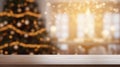 Wooden table in front of blurred christmas tree with bokeh lights Royalty Free Stock Photo