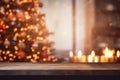 Wooden table in front of blurred Christmas tree with bokeh lights Royalty Free Stock Photo