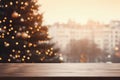 Wooden table in front of blurred Christmas tree with bokeh lights Royalty Free Stock Photo