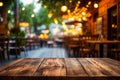 Wooden table is in front of restaurant with chairs and lights around it. Generative AI Royalty Free Stock Photo