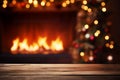 Wooden table in front of Warm Fireplace With Festive Decorations in a Cozy Room During Christmas Season Royalty Free Stock Photo