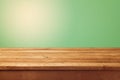 Wooden table and green background for product montage display