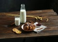 Wooden table homemade cookies with milk