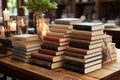 Wooden table hosts both e book reader and an array of hardcover books Royalty Free Stock Photo