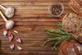 Kitchen table with eggs, rosemary, garlic and pepper mix