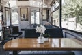 Wooden table inside an old train transformed into a restaurant Royalty Free Stock Photo