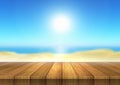 Wooden table looking out to defocussed beach landscape Royalty Free Stock Photo