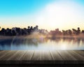 Wooden table looking out to a palm tree island Royalty Free Stock Photo