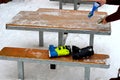 wooden table with metal edge. Facilities for putting on ski boots. Royalty Free Stock Photo