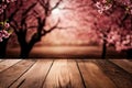 Wooden table mockup template with blossom spring blurred on the background