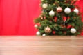Wooden table near blurred decorated Christmas tree Royalty Free Stock Photo