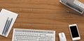 Wooden table with office supplies, top view