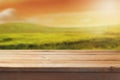 Wooden table over beautiful blur landscape background for product montage