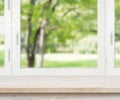 Wooden table over summer window background Royalty Free Stock Photo