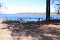 Wooden table in park near the water Royalty Free Stock Photo